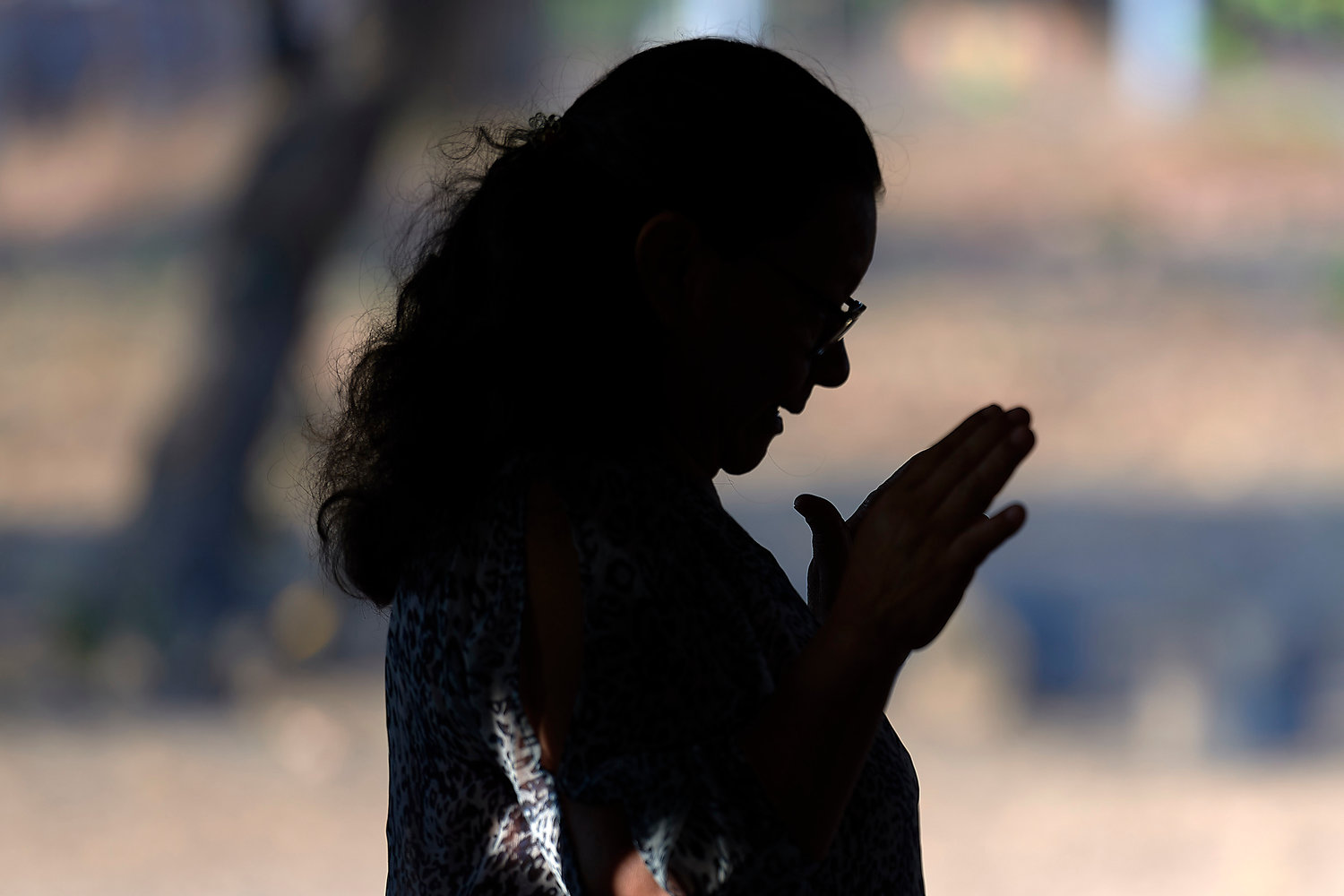 A woman prays during Mass April 6, 2019, in St. Ignatius, Guyana. Franciscan Father Joao Messias Sousa, who works among indigenous in the Amazon, said the people believe “God is in all things, but those things are not gods.”
